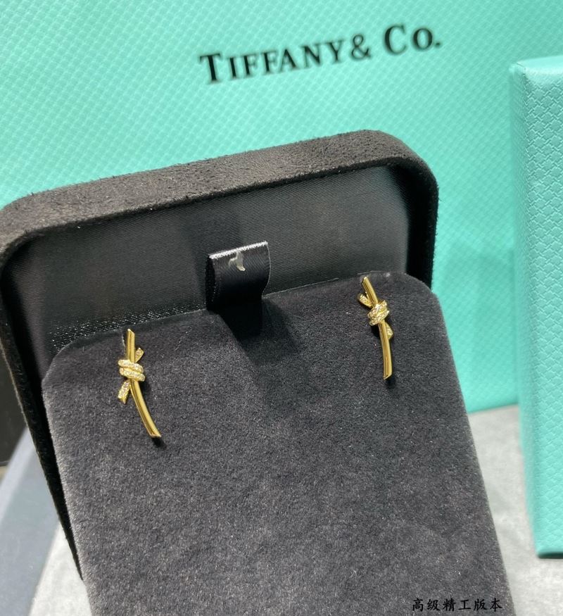 T*f*ny earrings